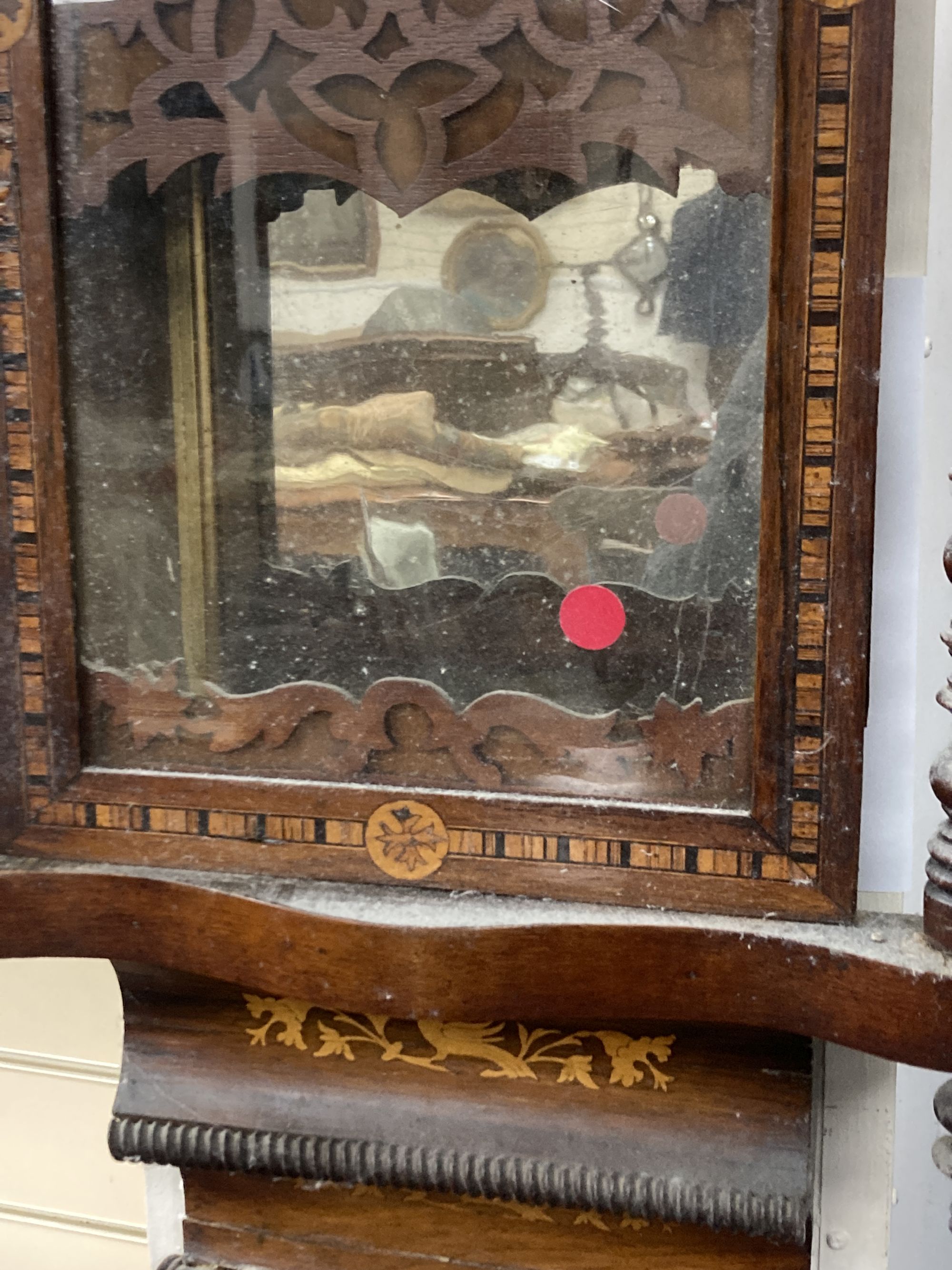 A 19th century American simulated rosewood wall clock, height 84cm, a 19th century inlaid wall clock and a mahogany pedestal cupboard